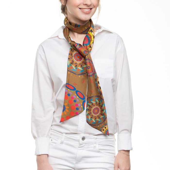 Model wearing the versatile Gratitude silk twilly around the neck, emphasizing the symbolic design that connects with life and gratitude.