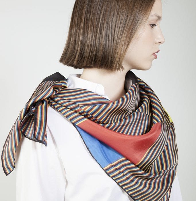 Close-up of the black 'Farewell' twill, focusing on the strong graphic quality of the vertical black panels and fine yellow lines.