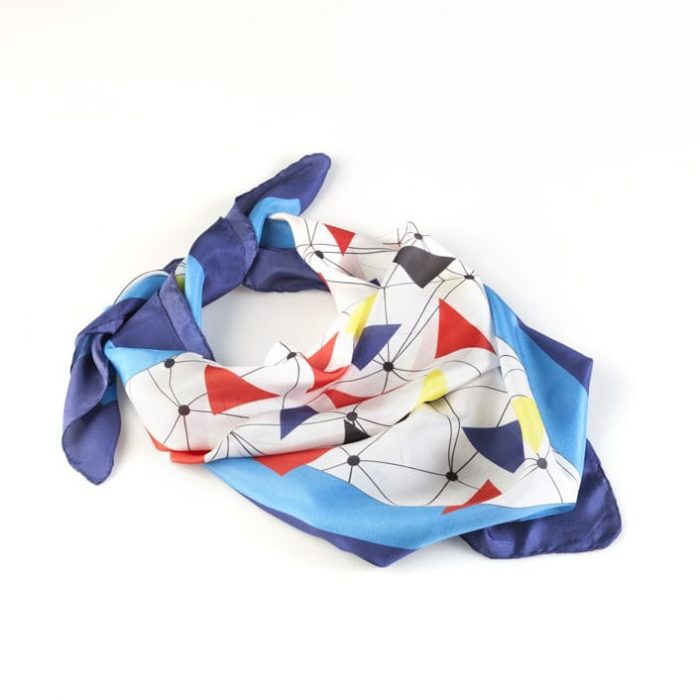 Close-up of the 'Flying Macaws' silk, emphasizing the subtle detail and connection lines on the soft, sheer fabric.