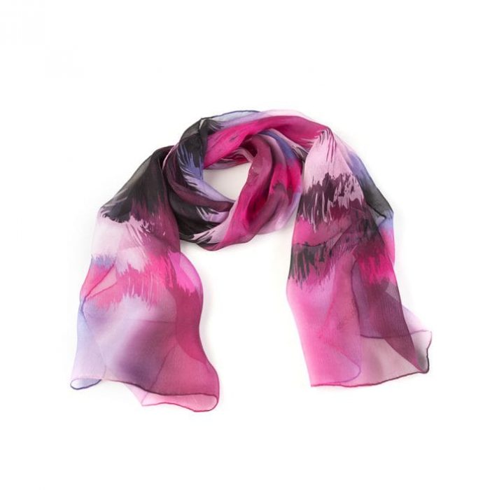 Artistic shot of the pink Sunset silk chiffon, emphasizing the transparency and the luminous effect of the light spot design.