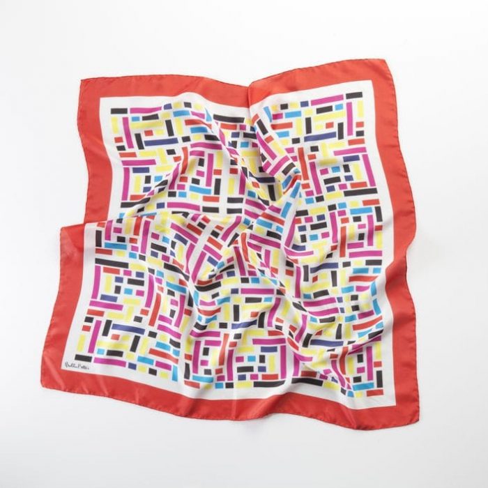 Abstract shot of the Wild West scarf, focusing on the high energy and movement suggested by the red rectangular patterns.