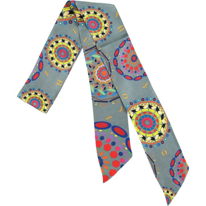 Gratitude silk twilly styled as a wrist accessory, showing the strong grey contrast against the gray background. Perfect gift to show appreciation.