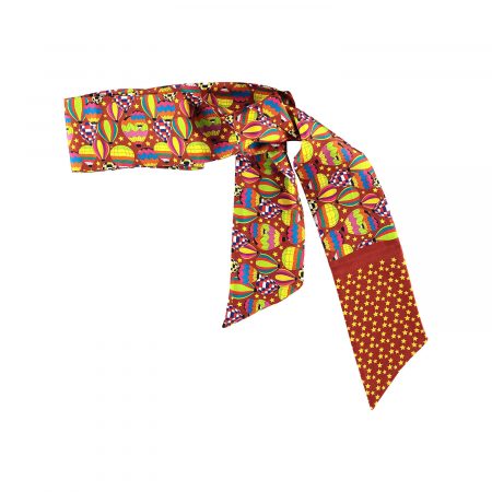 Versatile brown silk twilly tied to a handbag handle for a sophisticated look.