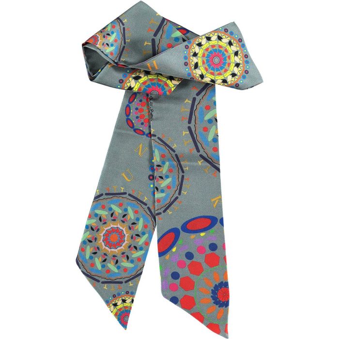 Limited edition Gratitude twilly in a gray-focused colorway. Designer silk twill accessory from Barcelona with mandala pattern.