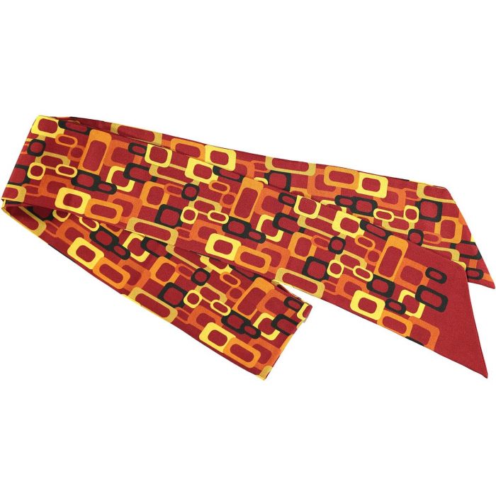 Links twilly tied to a brown handbag, showcasing the harmonious pattern of interlocking ocher and gray shapes on a vibrant red background. Timeless accessory.